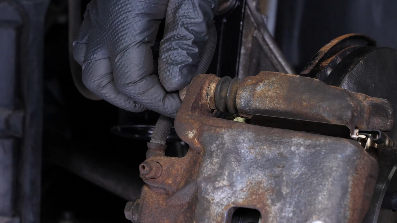 Put the brake caliper back