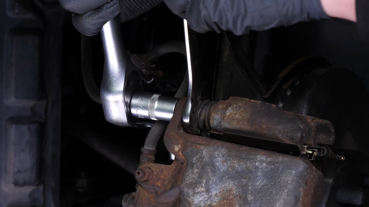 Put the brake caliper back