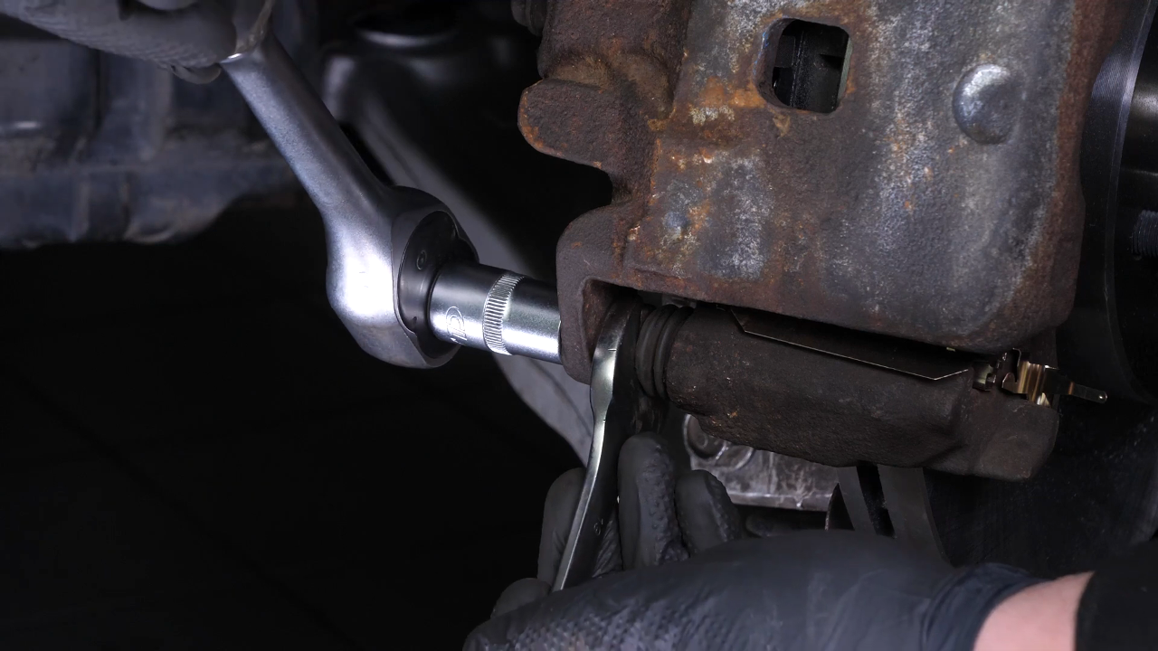 Put the brake caliper back