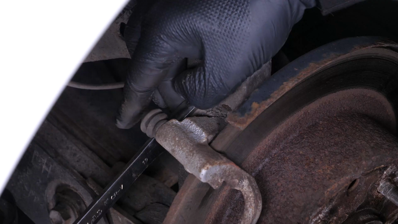 Remove the brake caliper mount