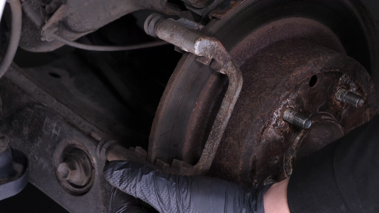 Remove the brake caliper mount