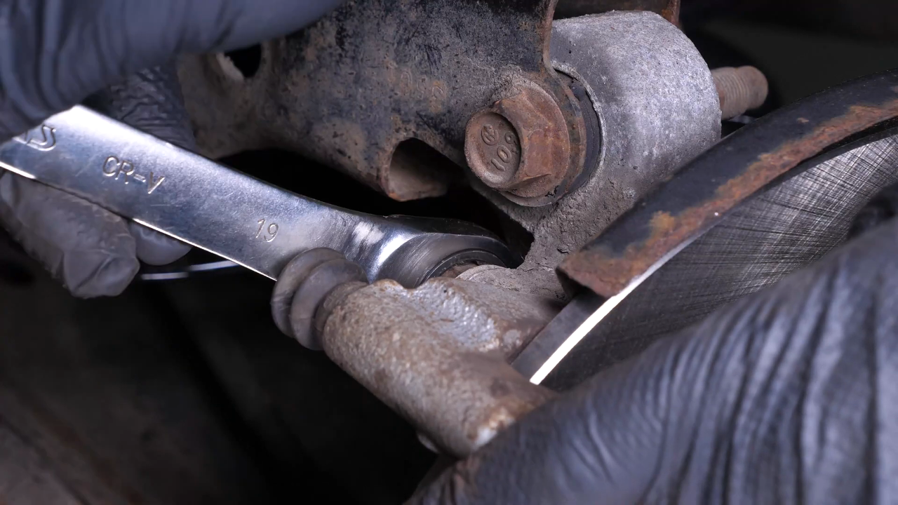 Put the brake caliper mount back on