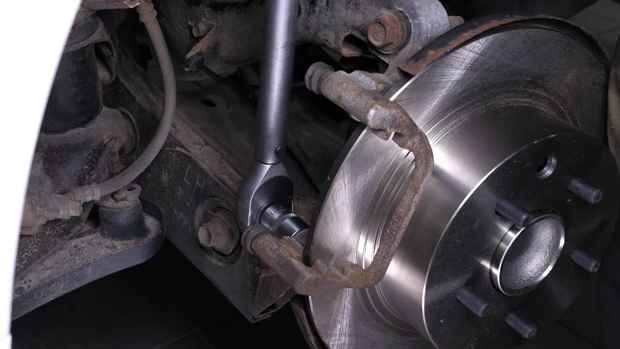 Put the brake caliper mount back on