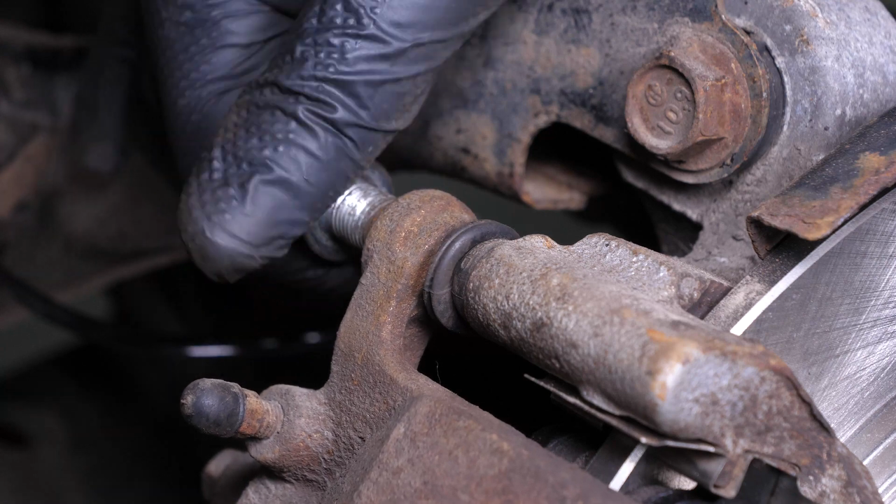 Put the brake caliper back