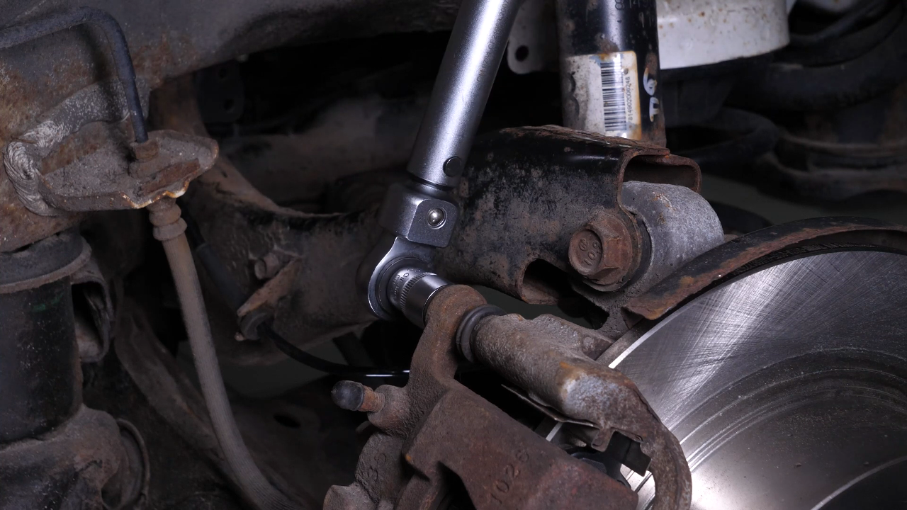 Put the brake caliper back