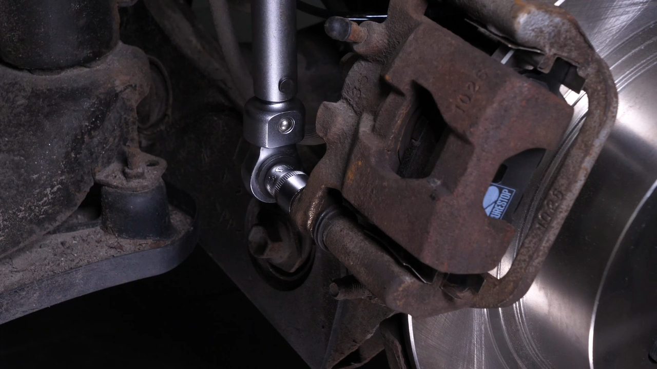 Put the brake caliper back