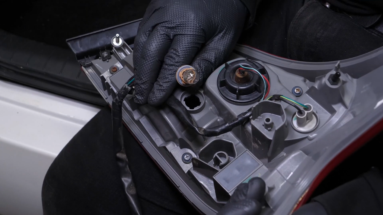 Replace the reverse light bulb