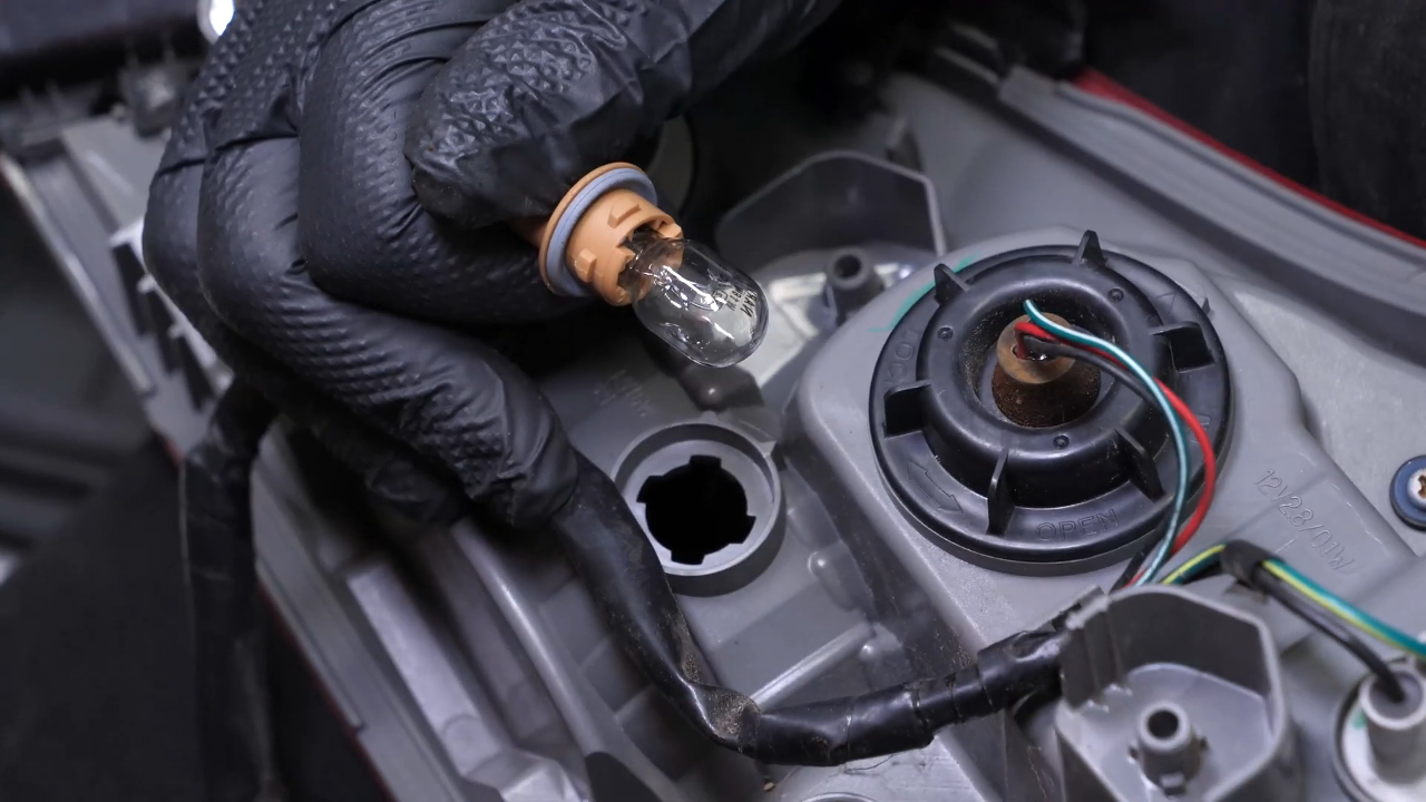 Replace the reverse light bulb