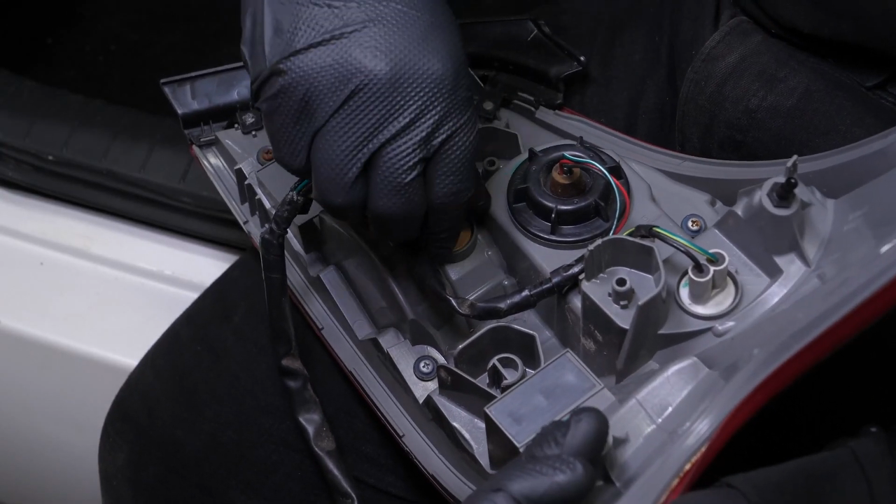 Replace the reverse light bulb