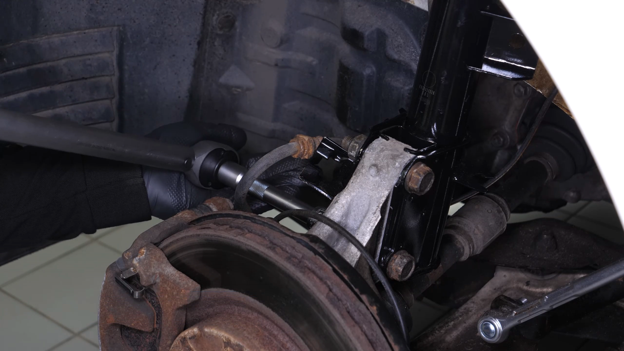 Reinstall the strut in the wheel knuckle