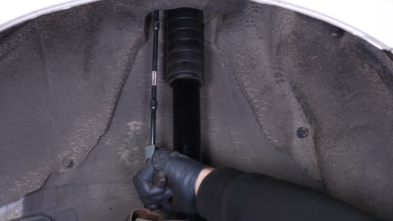 Install the new shock absorber