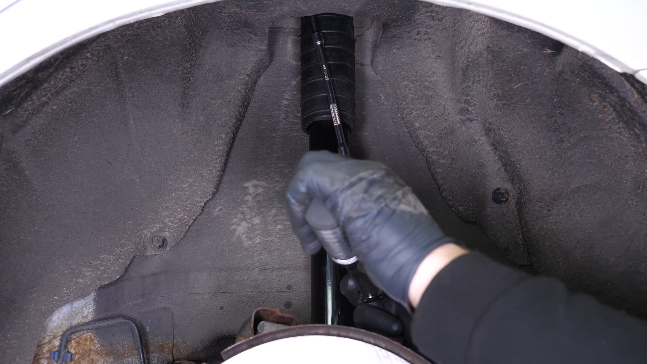 Install the new shock absorber
