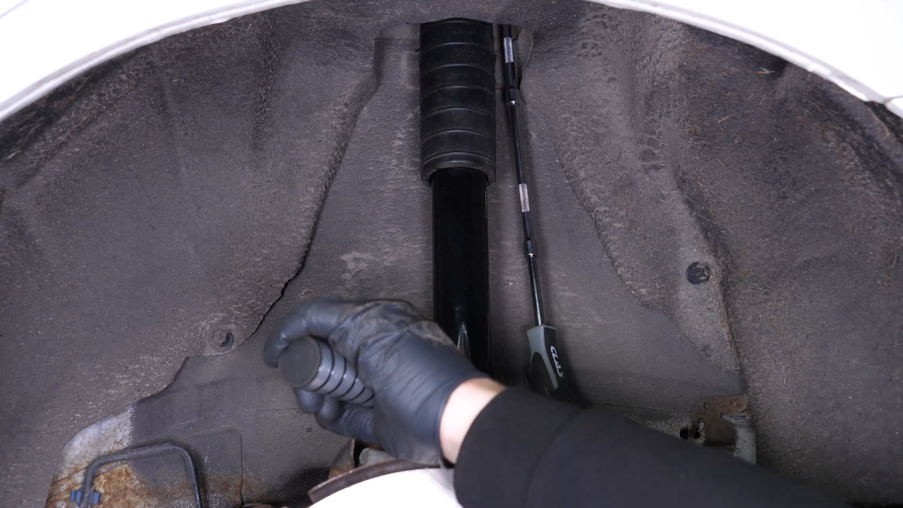 Install the new shock absorber