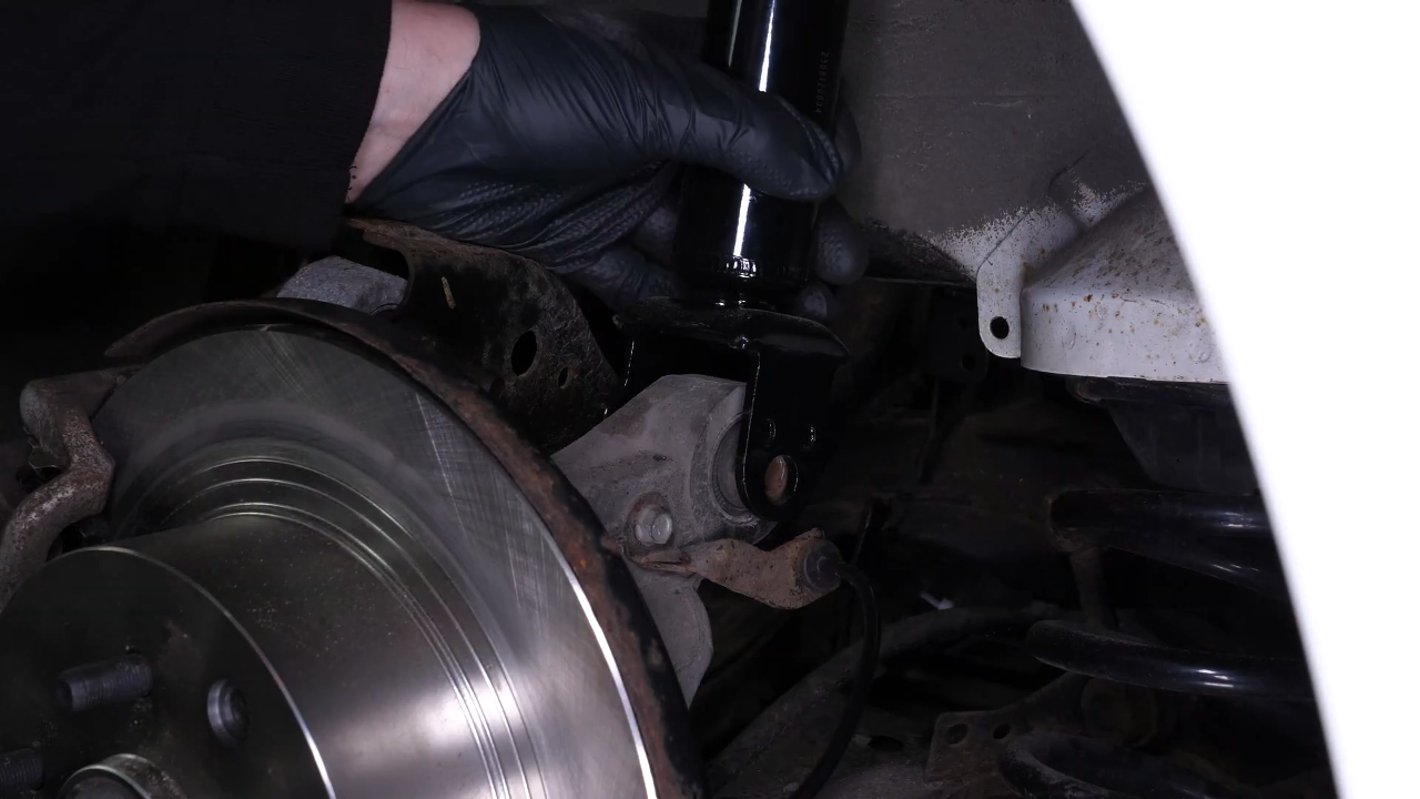 Reinstall the strut in the wheel knuckle