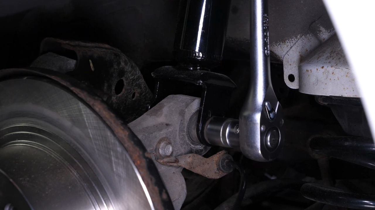 Reinstall the strut in the wheel knuckle