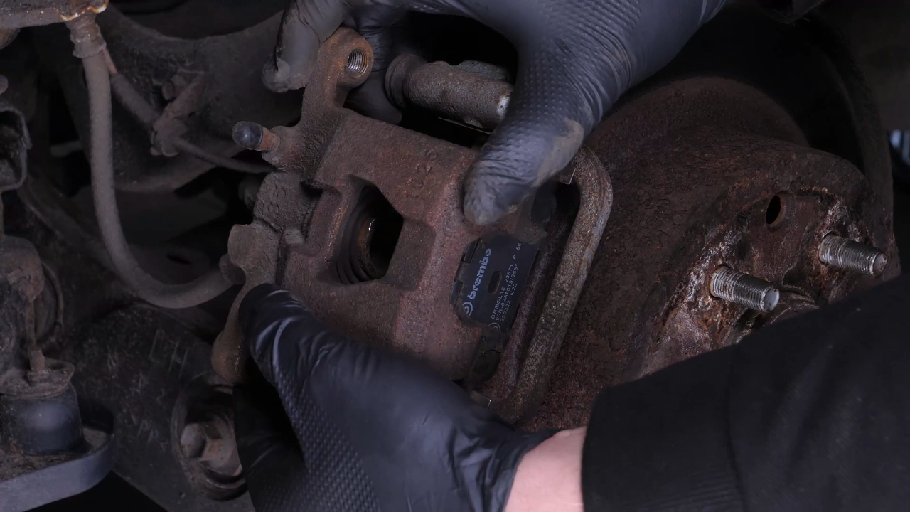 Remove the brake caliper