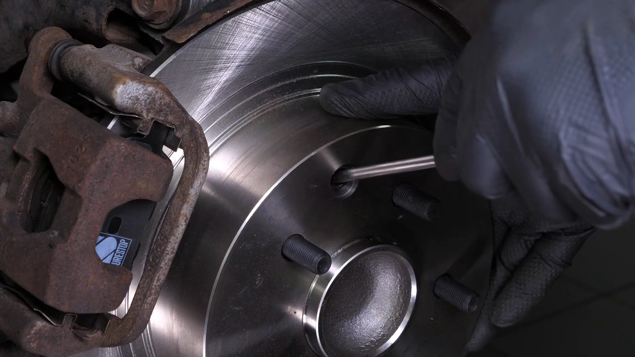 Put the brake caliper back