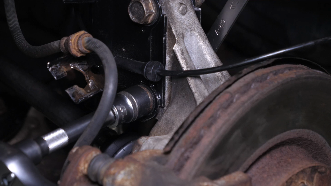 Reinstall the strut in the wheel knuckle