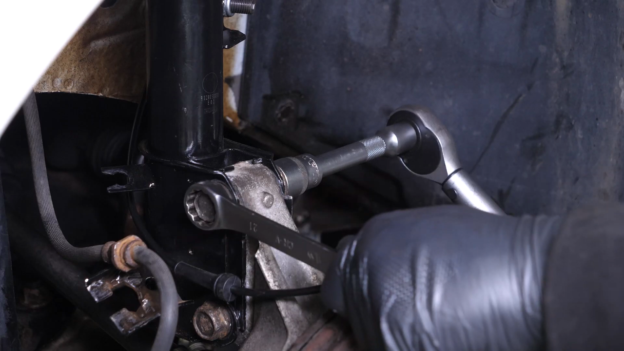 Reinstall the strut in the wheel knuckle