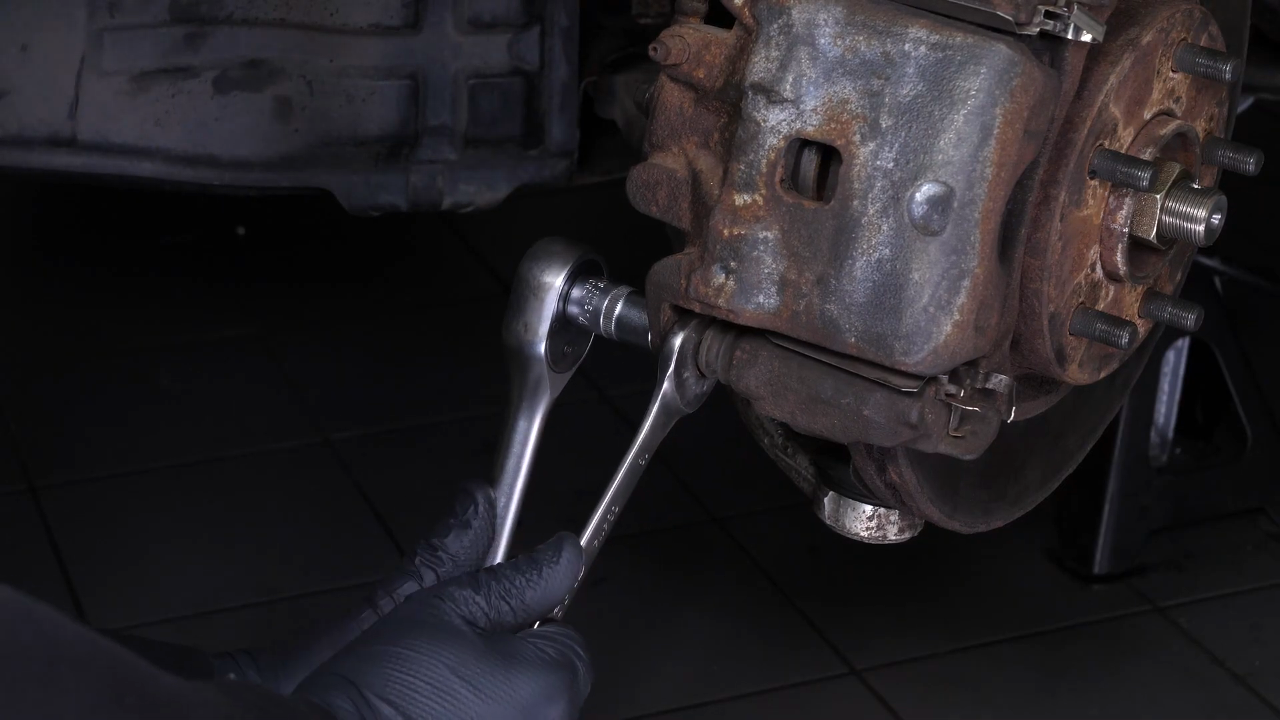 Remove the brake caliper