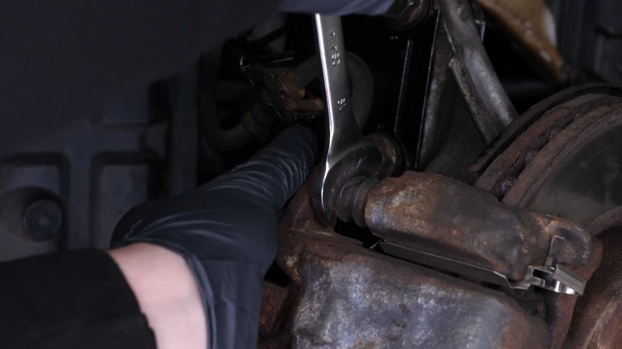 Remove the brake caliper