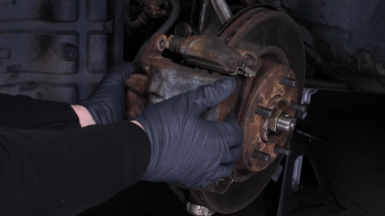 Remove the brake caliper