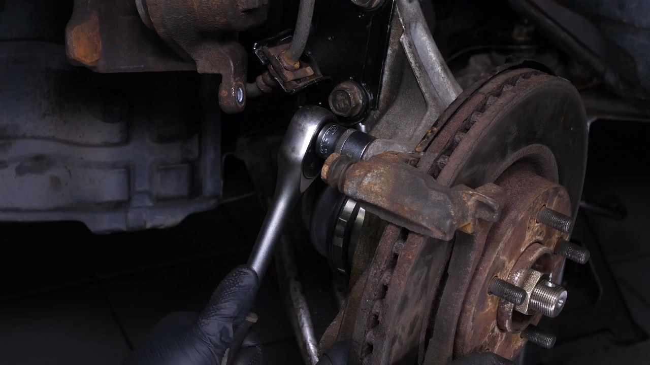 Remove the  brake caliper mount