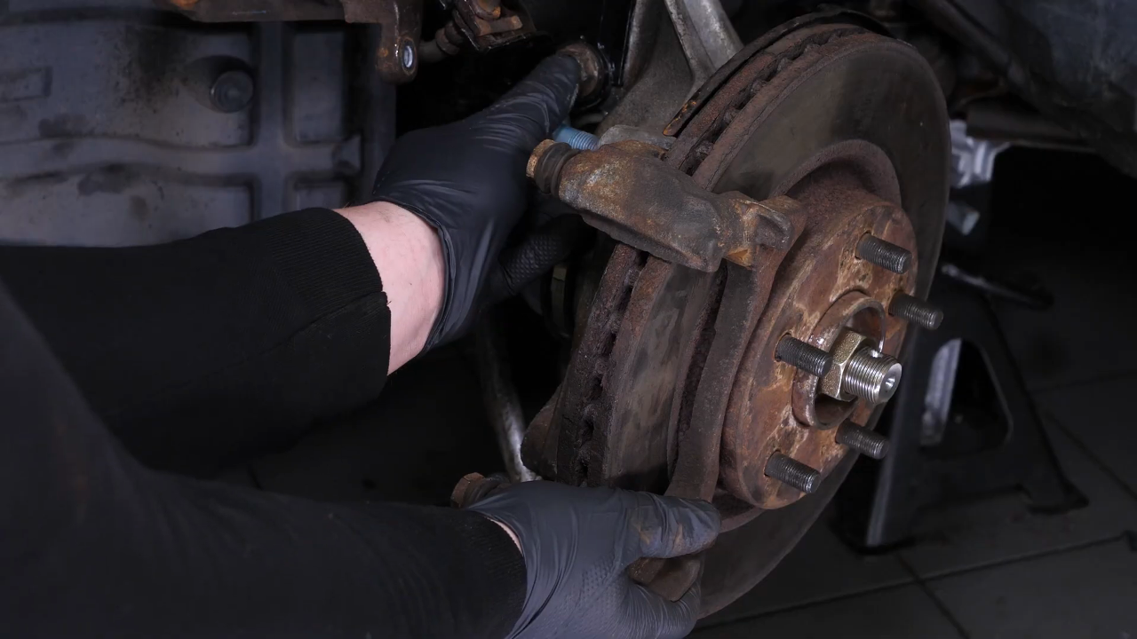 Remove the  brake caliper mount