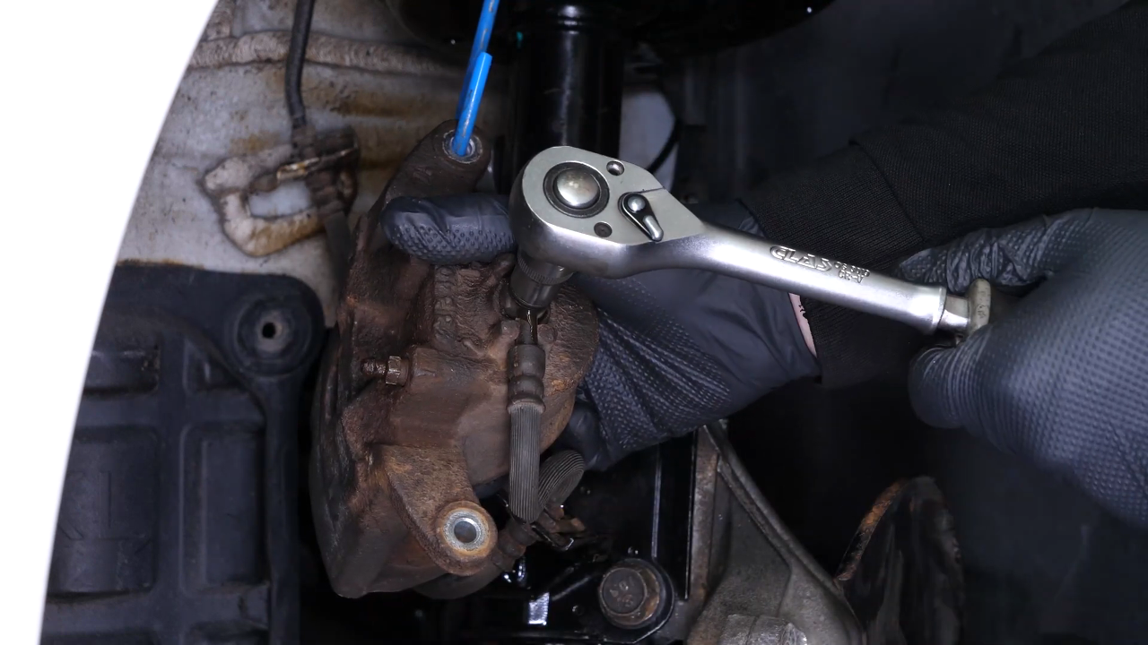 Unscrew the brake hose from the caliper