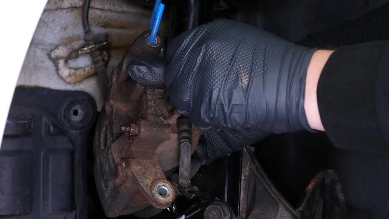 Unscrew the brake hose from the caliper