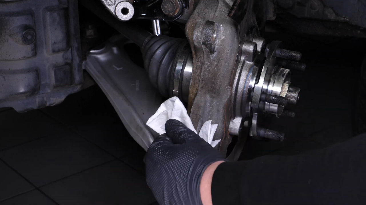 Put the brake caliper mount back on