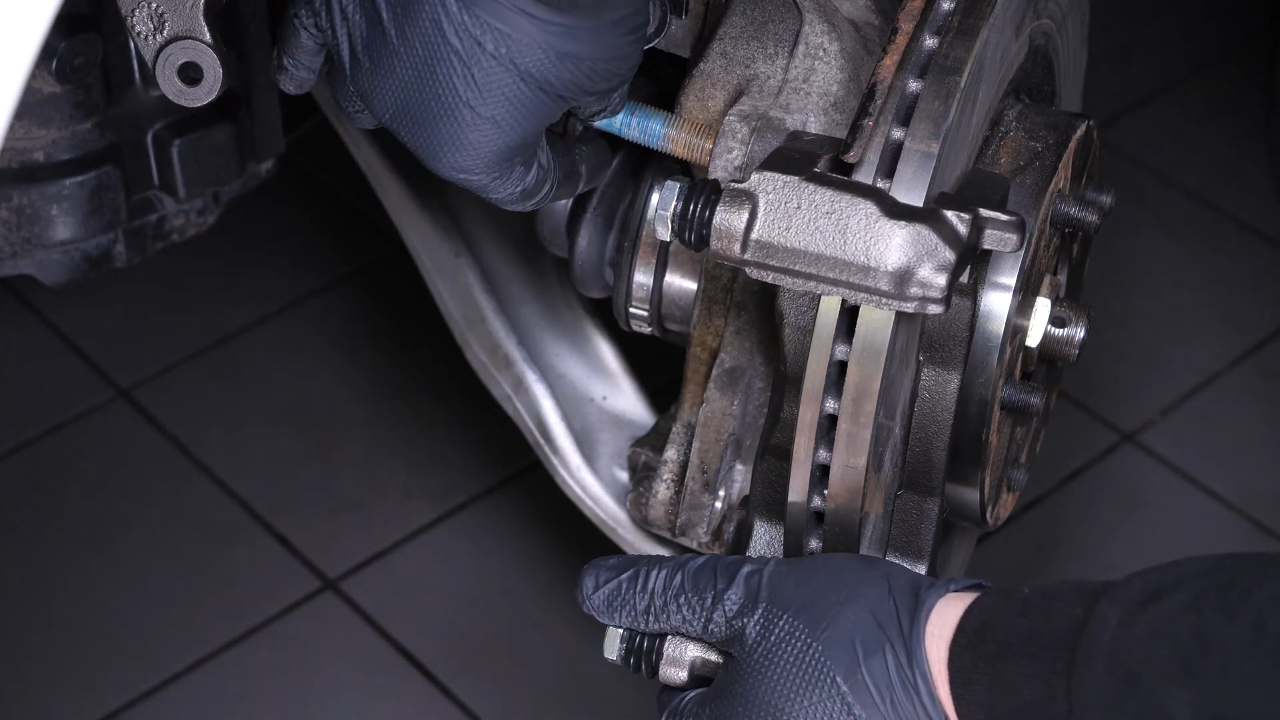 Put the brake caliper mount back on