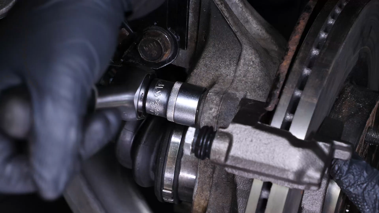 Put the brake caliper mount back on