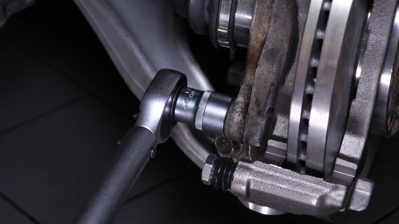 Put the brake caliper mount back on