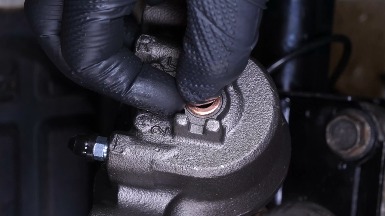 Put the new brake caliper back