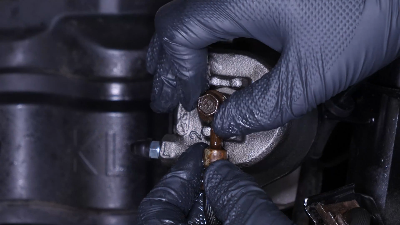 Put the new brake caliper back