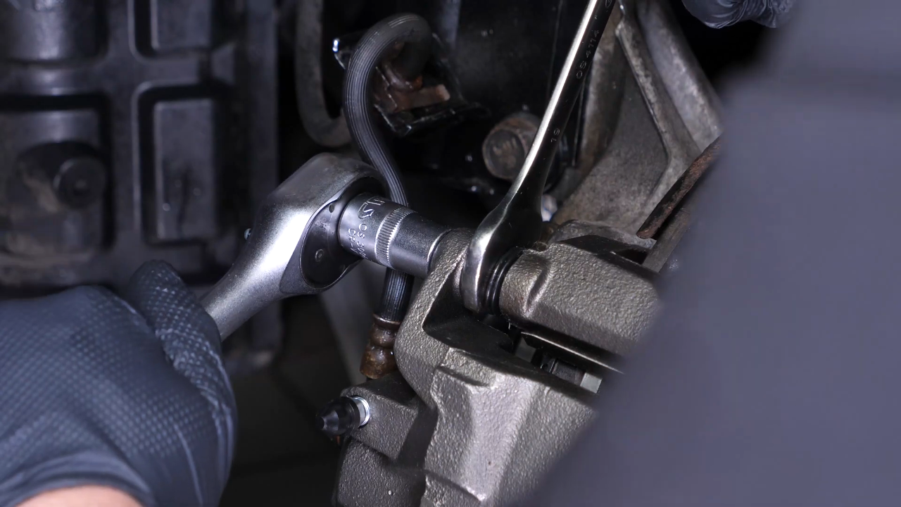 Put the new brake caliper back