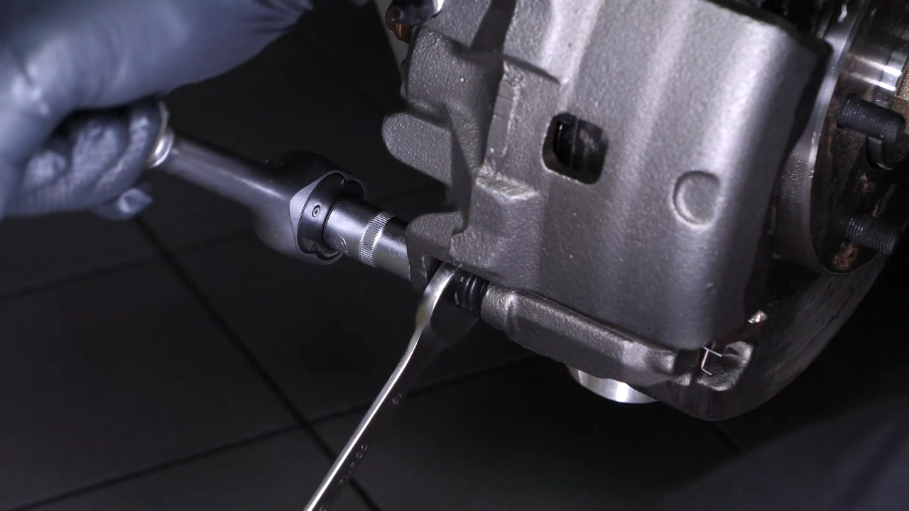 Put the new brake caliper back