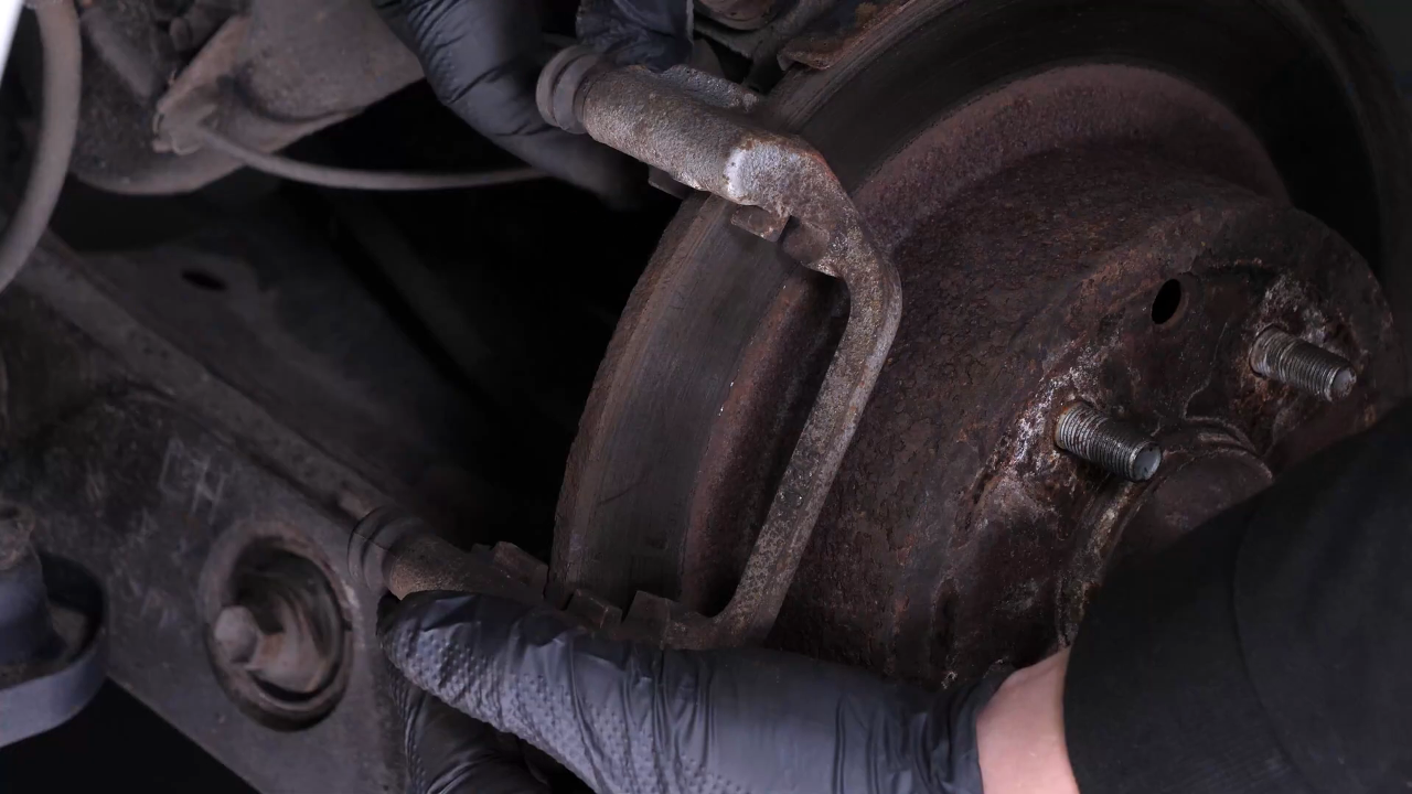 Remove the  brake caliper mount