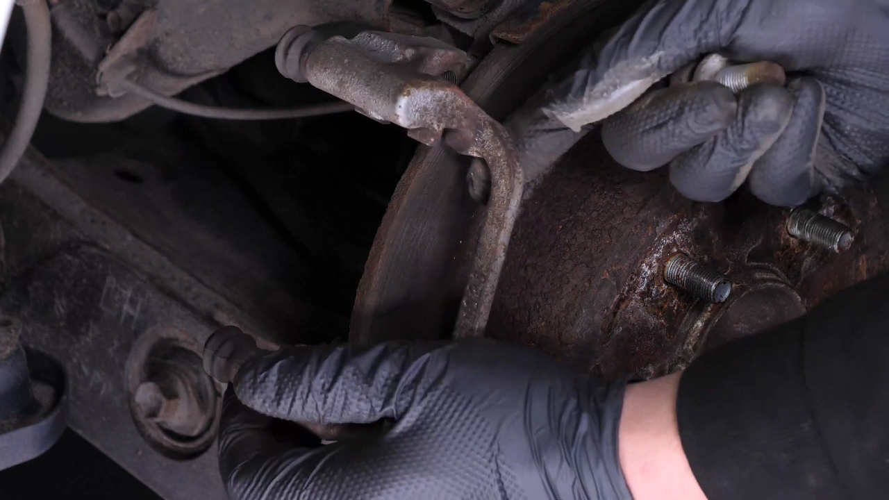 Remove the  brake caliper mount
