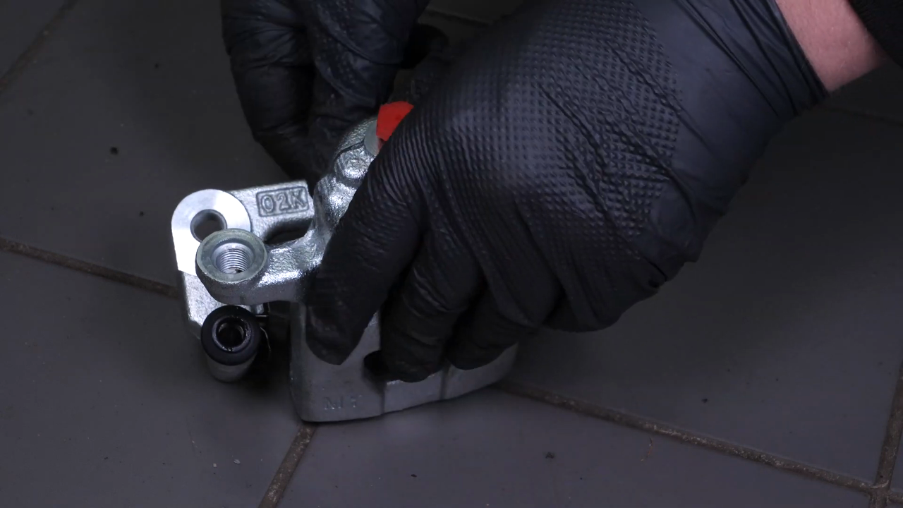 Put the brake caliper mount back on