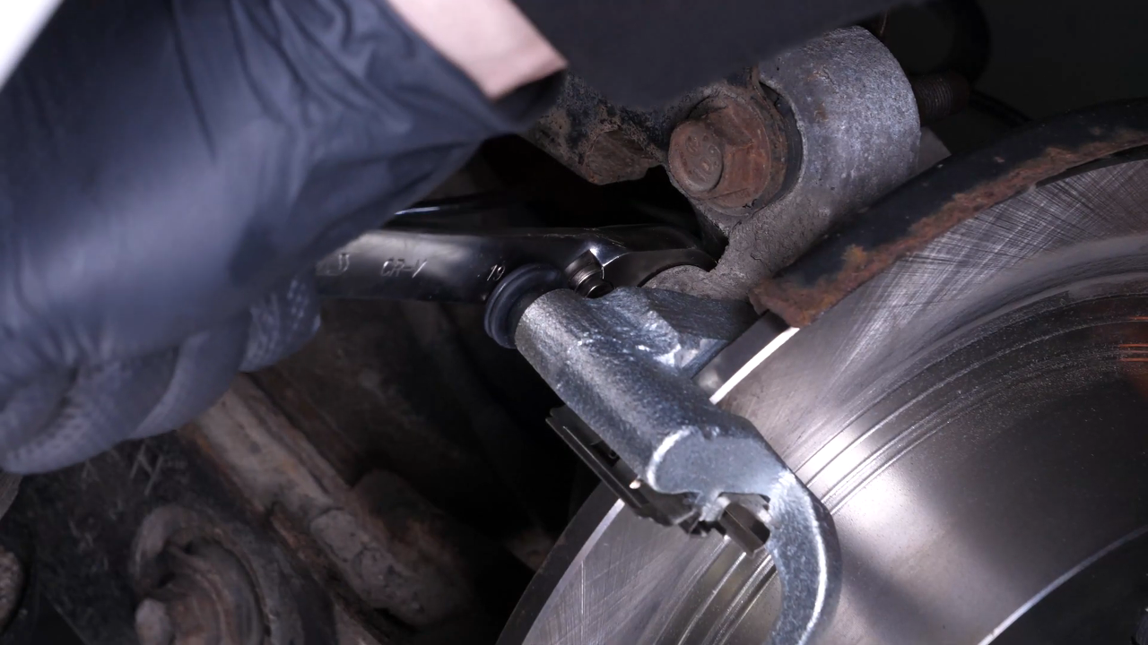Put the brake caliper mount back on