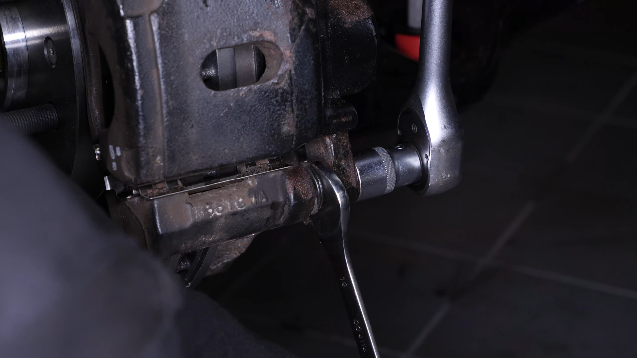 Remove the brake caliper