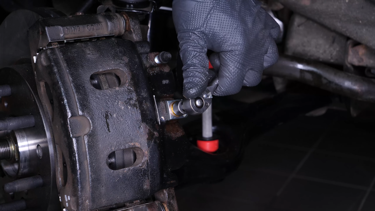 Remove the brake caliper