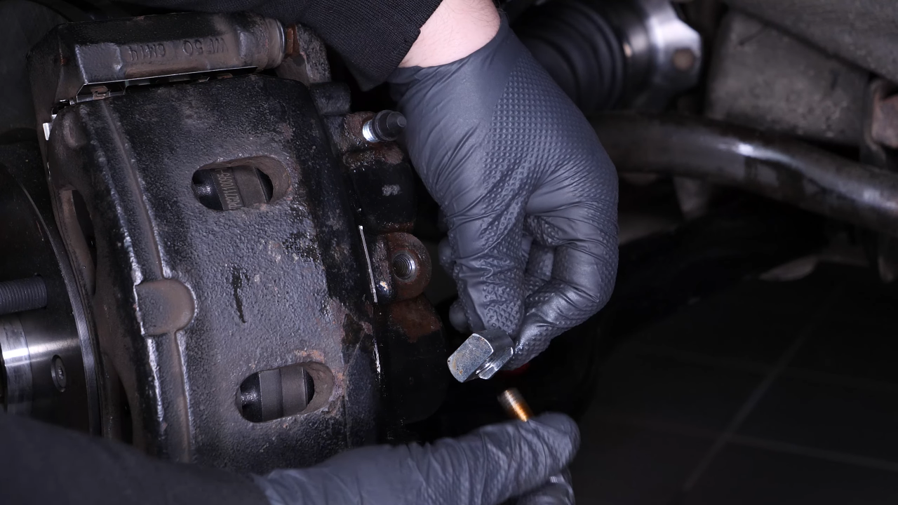 Remove the brake caliper