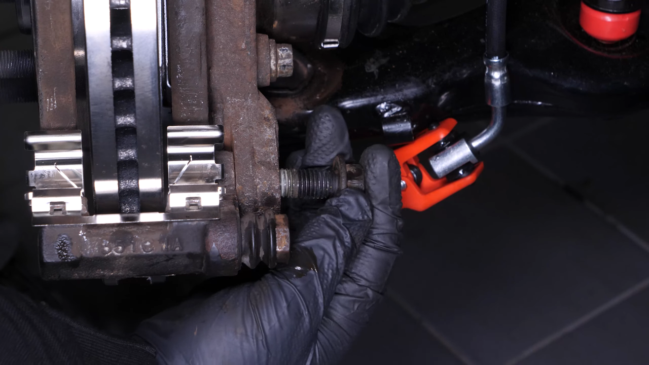Remove the brake caliper mount