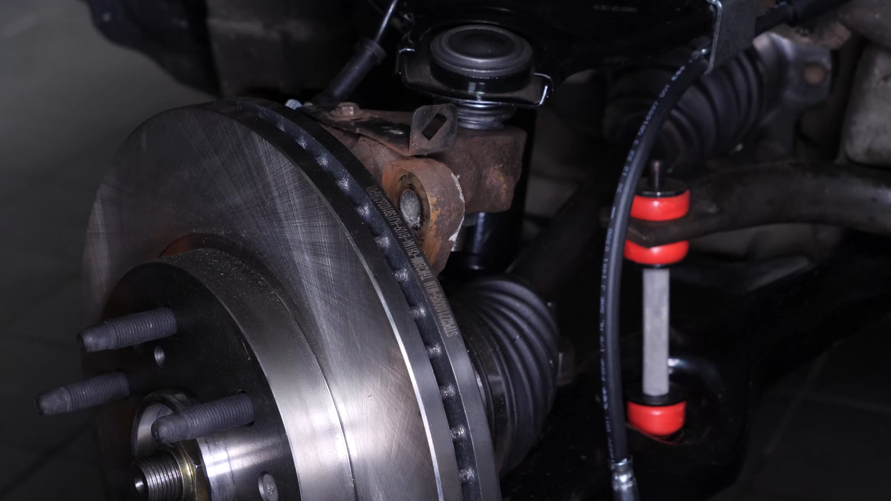 Remove the brake caliper mount