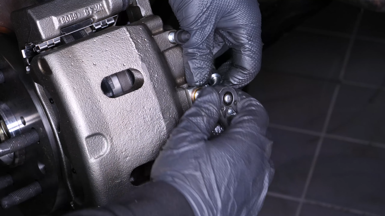Screw the brake hose back on the caliper