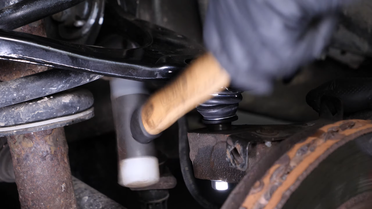 Remove the control arm ball joint