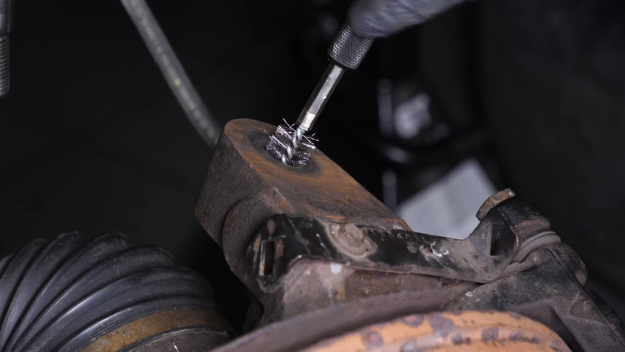 Put the control arm ball joint back